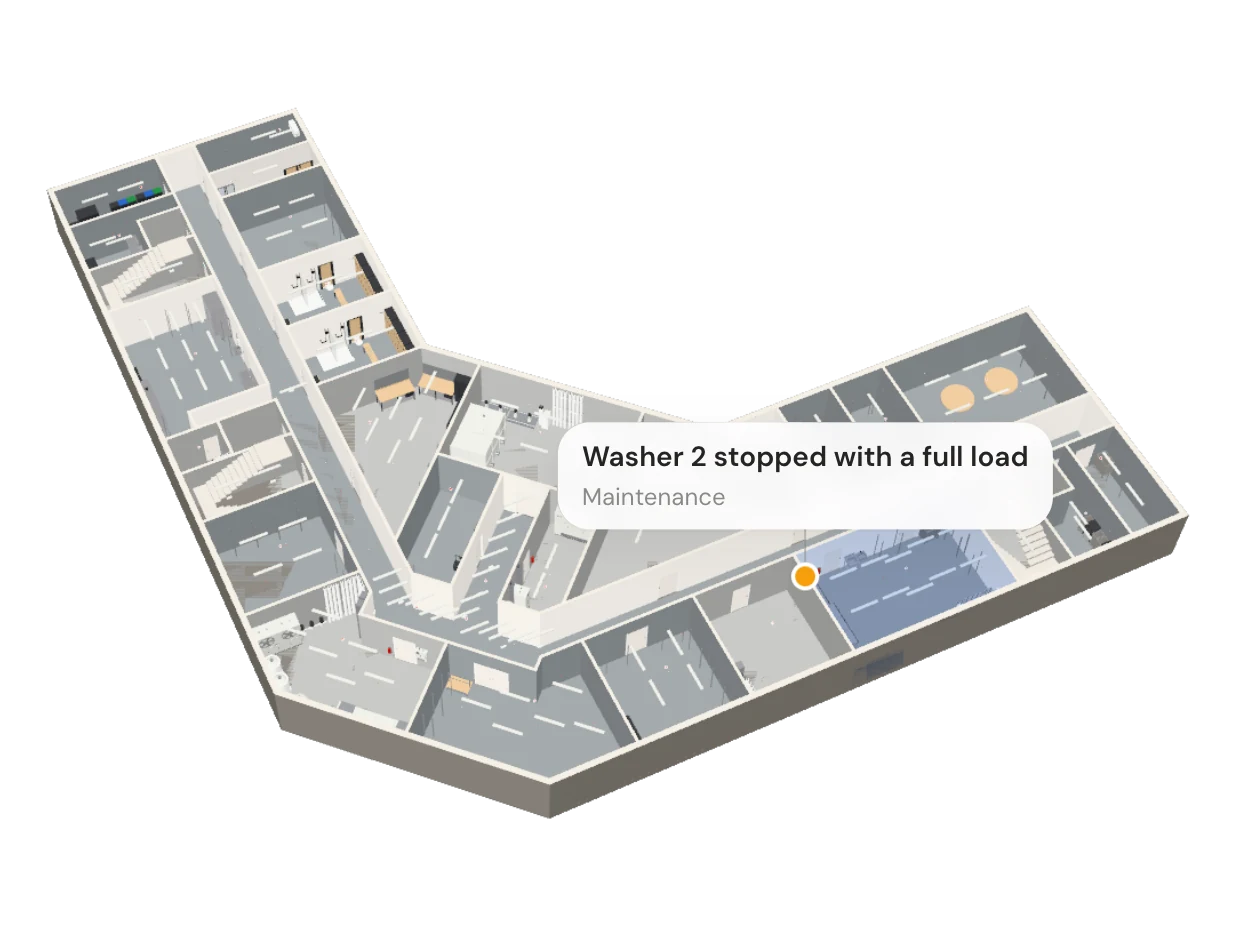 The Basement of the Vabumi Hotel, seen from above with the floors over it lifted away. The Laundry is tinted, and a card on it reads: Washer 2 stopped with a full load, Maintenance.